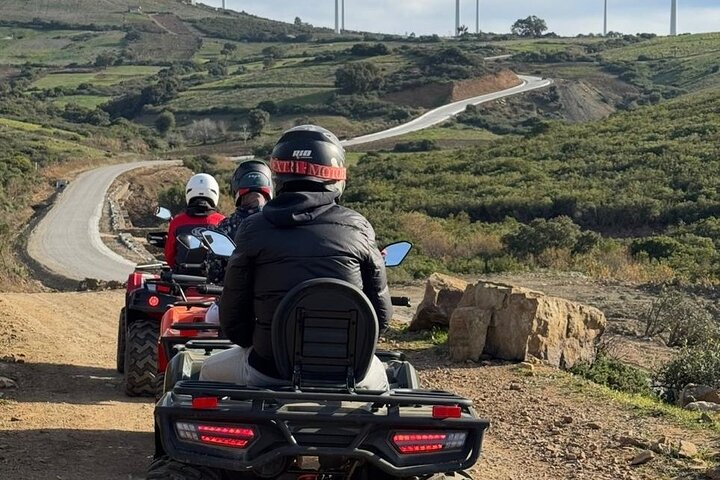 Quad riders on scenic country road